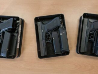 Assorted Glock pistols on display highlighting concealed carry options.